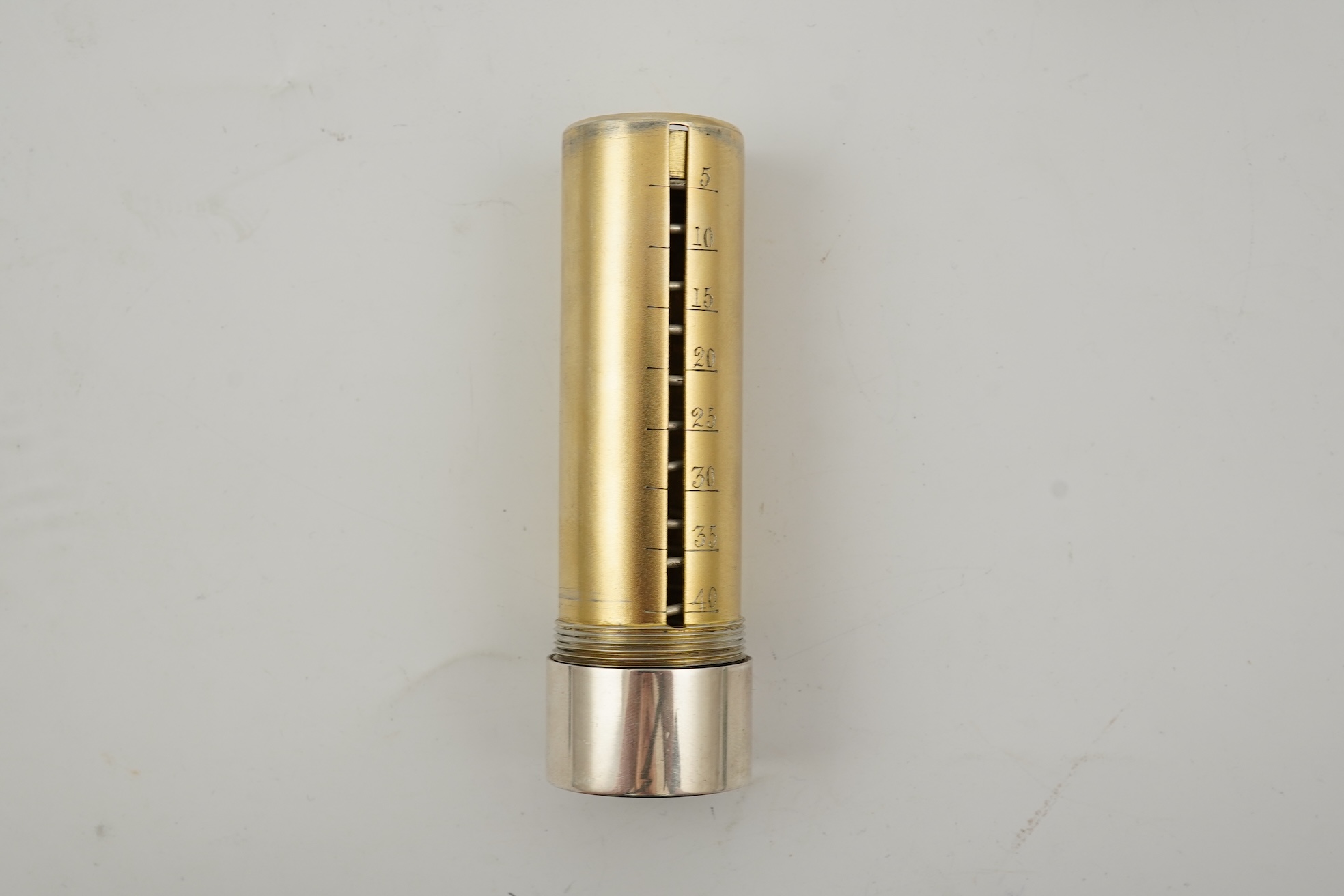 A late Victorian parcel gilt silver tubular coin holder, by Frederic Purnell